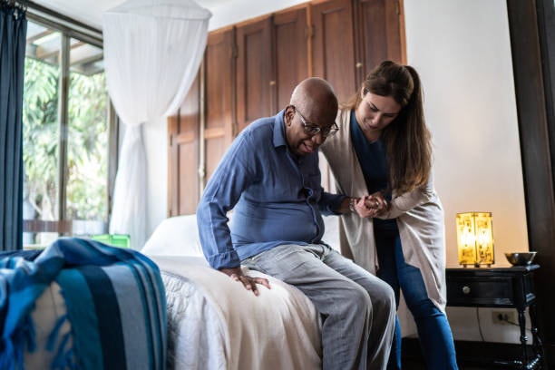 A caregiver and client sharing a warm moment at home